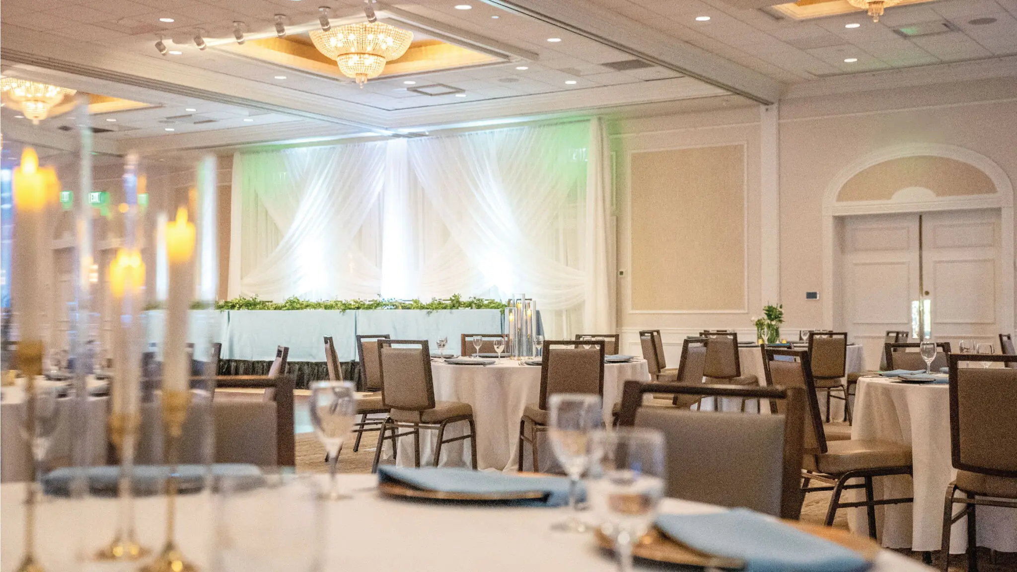 Lake Country Ballroom set up for a wedding reception with baby blue and gold accents.