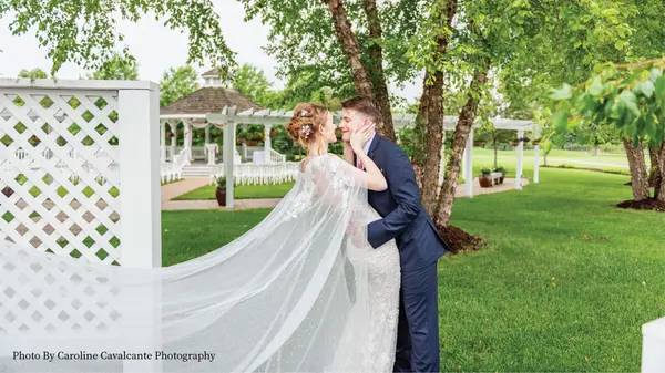 Wedding couple posing in front of the Ingleside Gazebo.