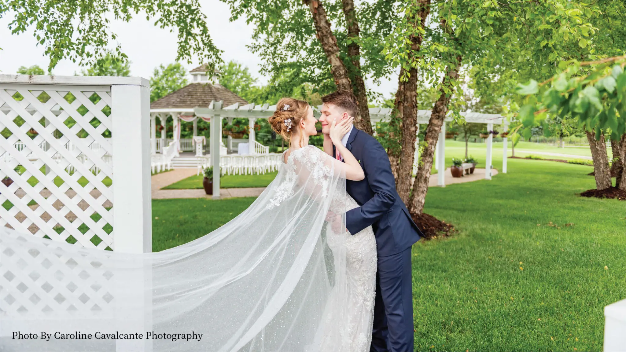 Wedding couple posing in front of the Ingleside Gazebo.
