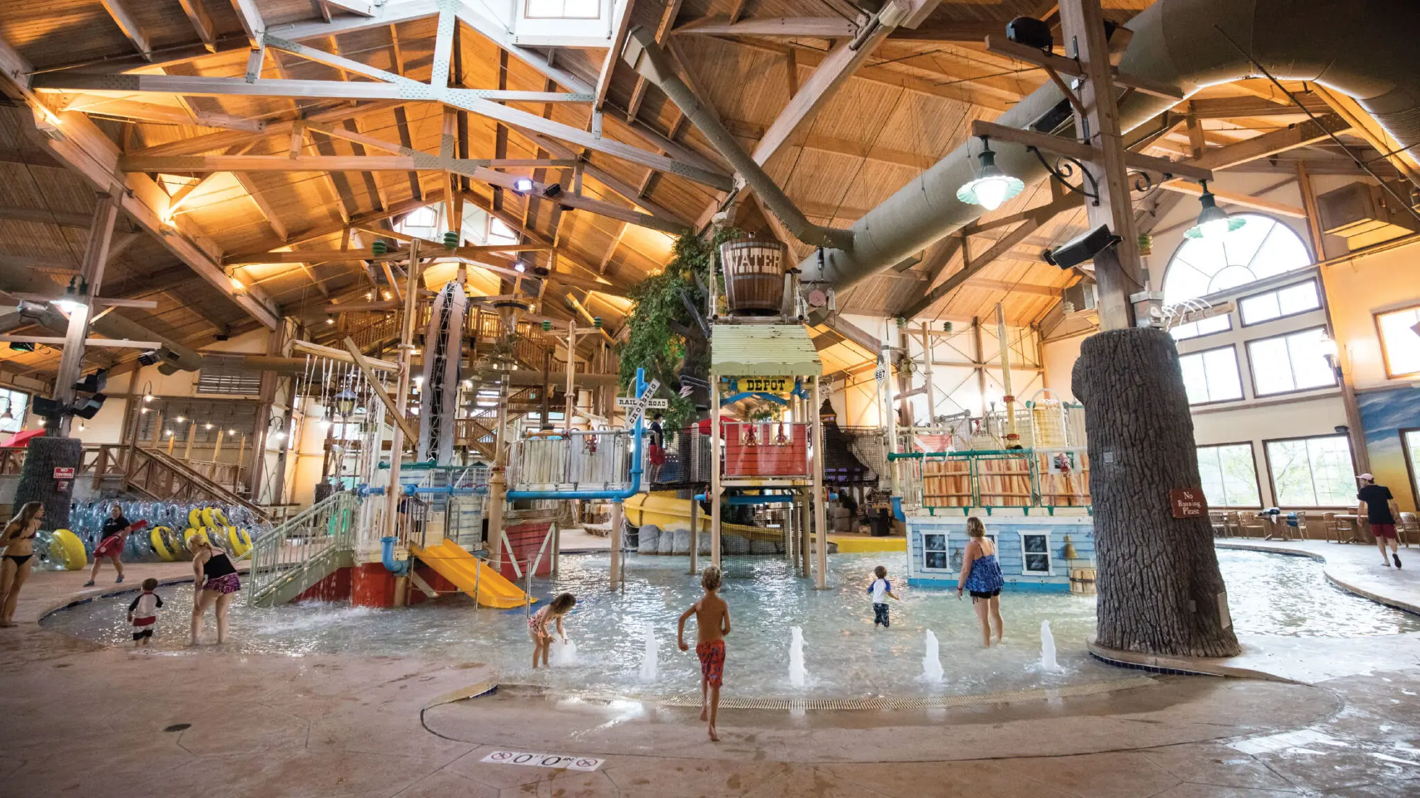 Springs Water Park play structure with kids and adults spalshing and playing.